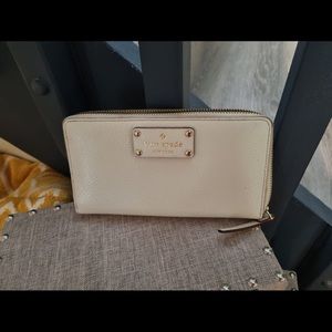 Kate Spade off white zip wallet with gold dots inside. Gently worn.